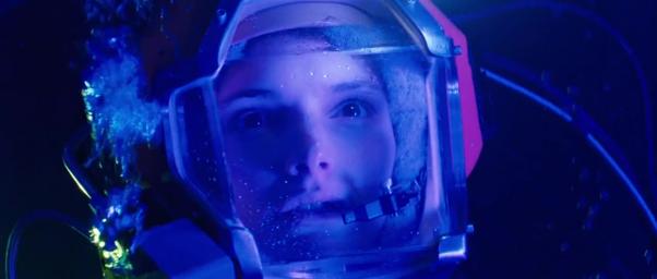 A diver suspended in deep cobalt-blue water in a representative frame from The Abyss (1989).