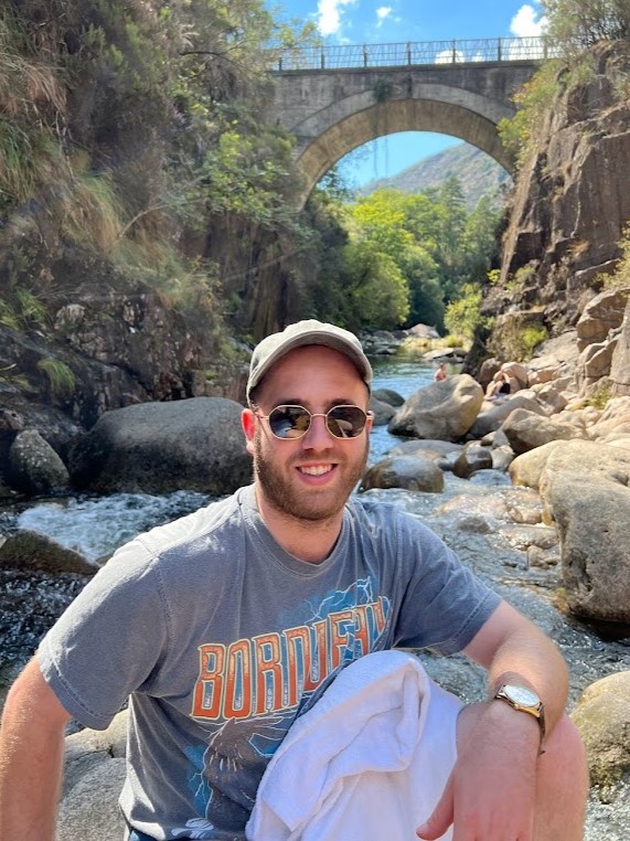 Tomer Zipori outdoors, looking toward the camera